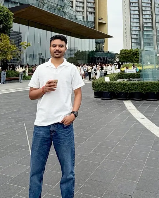 Parth Koshta in a modern city plaza